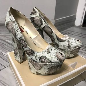 Creme, tan and dark snakeskin like chunky heels.